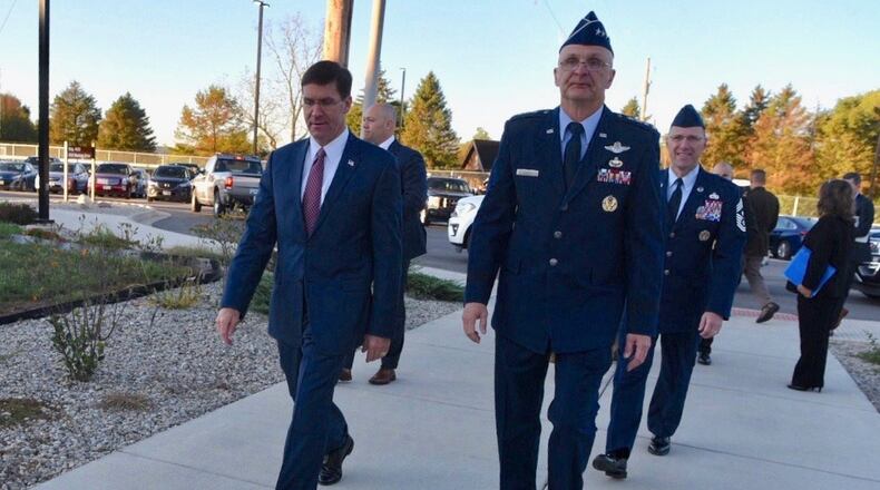 Secretary of Defense Mark T. Esper, left, walks with Gen. Arnold Bunch, right, Air Force Materiel Commander, during a visit to Wright-Patterson Air Force Base on Oct. 4, 2019. Esper’s visit marked the first time he had been to Wright-Patt during his time as defense secretary.