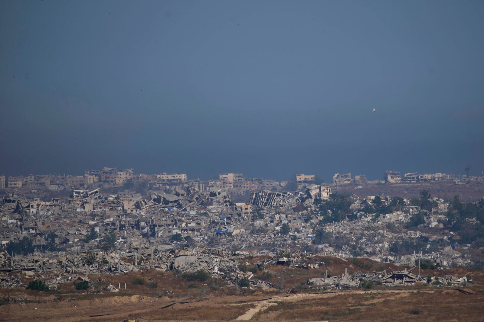 Destroyed buildings in the Gaza Strip as seen from southern Israel, Tuesday, May 6, 2025. (AP Photo/Ohad Zwigenberg)