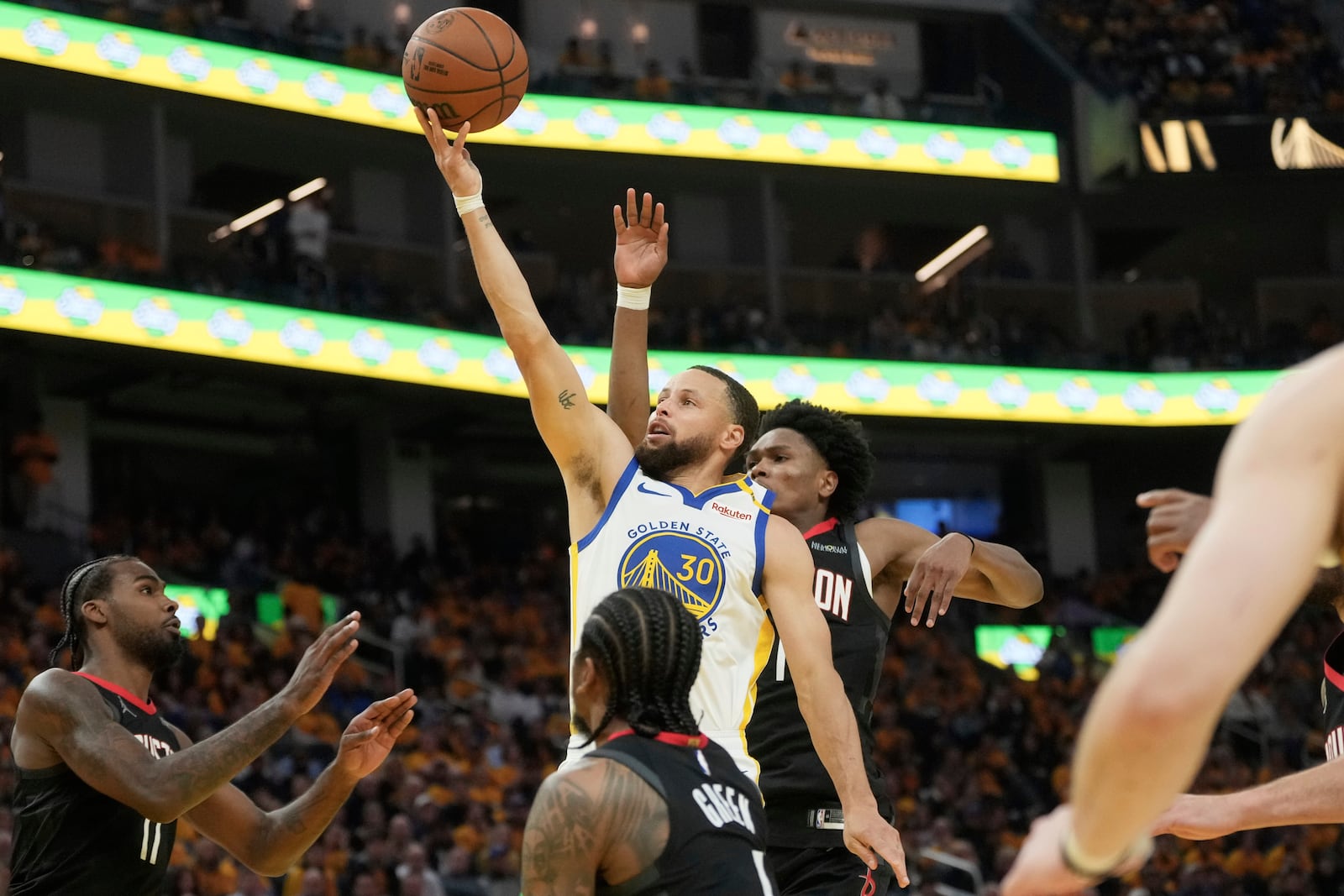 Golden State Warriors guard Stephen Curry (30) shoots against the Houston Rockets during the first half of Game 3 of an NBA basketball first-round playoff series in San Francisco, Saturday, April 26, 2025. (AP Photo/Jeff Chiu)