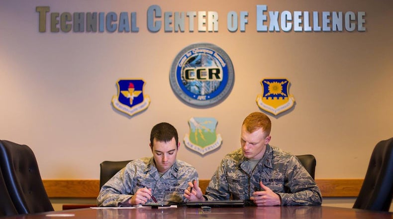 Capt. Seth Martin (left) and 2nd Lt. Landon Tomcho earned master’s degrees in cyber operations and computer science from the Air Force Institute of Technology in 2019. AFIT has been re-designated as a National Center of Academic Excellence in Cyber Defense Research. (U.S. Air Force photo/Bruce Lambert)