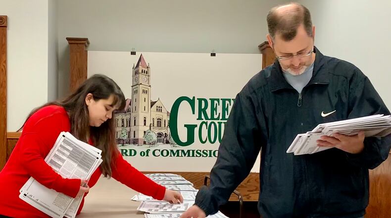Workers at the Greene County Board of Elections match paper ballots Thursday afternoon. LONDON BISHOP/STAFF