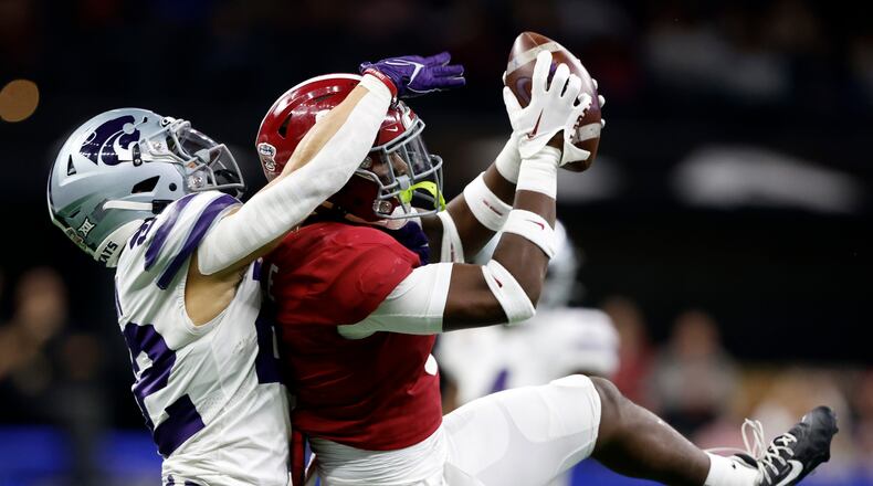 Alabama defensive back Jordan Battle (9) intercepts a pass intended for Kansas State running back Deuce Vaughn (22) during the first half of the Sugar Bowl NCAA college football game Saturday, Dec. 31, 2022, in New Orleans. (AP Photo/Butch Dill)