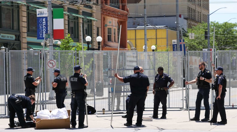 Law enforcement takes down the fencing surrounding the NATO Parliamentary Assembly in Dayton, Monday, May 26, 2025. BRYANT BILLING/STAFF