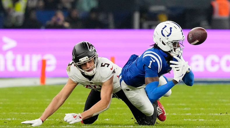 Indianapolis Colts cornerback Sauce Gardner (1) breaks up a pass intended for Atlanta Falcons wide receiver Drake London (5) during the second half of an NFL football game, Sunday, Nov. 9, 2025, in Berlin, Germany. (AP Photo/Martin Meissner)