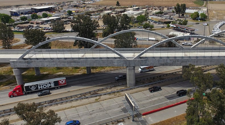 FILE - The Cedar Viaduct, designed to take high-speed trains over Cedar and North avenues and State Route 99, is shown in an aerial view, Tuesday, April 15, 2025, in Fresno, Calif. (AP Photo/Godofredo A. Vásquez, File)