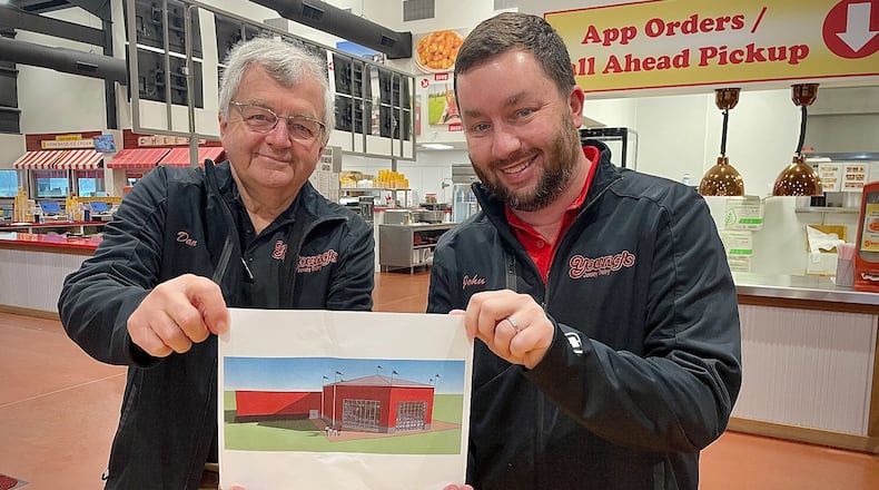 After more than a decade of ideas, Young’s Jersey Dairy has decided to add a carousel and an imagination space for children to a new building that will be constructed on the property. Pictured is Dan Young and his son, John.
