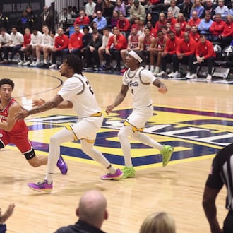 Dayton's Javon Bennett looks to make a pass against La Salle on Wednesday, Jan. 21, 2026, at John E. Glaser Arena in Philadelphia. David Jablonski/Staff