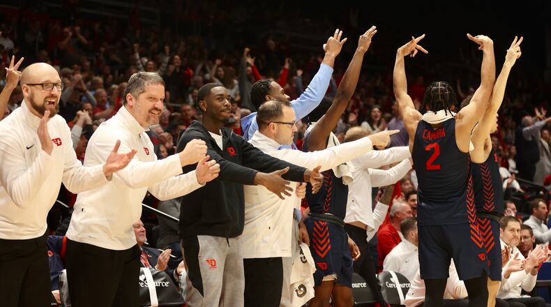 The Dayton bench reacts to a basket during a game against Alcorn State on Tuesday, Dec. 20, 2022, at UD Arena. David Jablonski/Staff