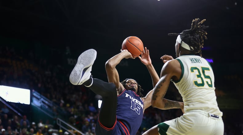Dayton's DaRon Holmes II scores as he's fouled in the first half against George Mason on Wednesday, Feb. 21, 2024, at EagleBank Arena in Fairfax, Va. He completed the 3-point play. David Jablonski/Staff