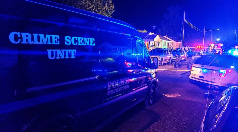 Middletown fire and police crews responded to a house fire Friday evening, Aug. 14, 2020, in the 1200 block of Lind Street. NICK GRAHAM/STAFF