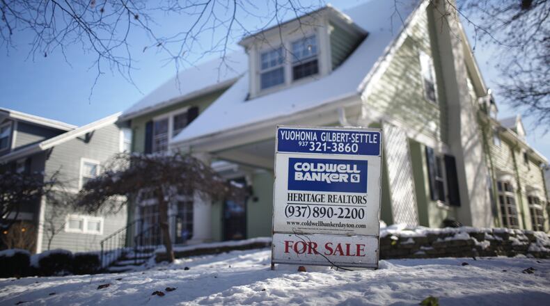 Home sales are their highest in years, according to Montgomery County Auditor Karl Keith. This home sale sign is on Volusia Avenue in Oakwood. TY GREENLEES / STAFF