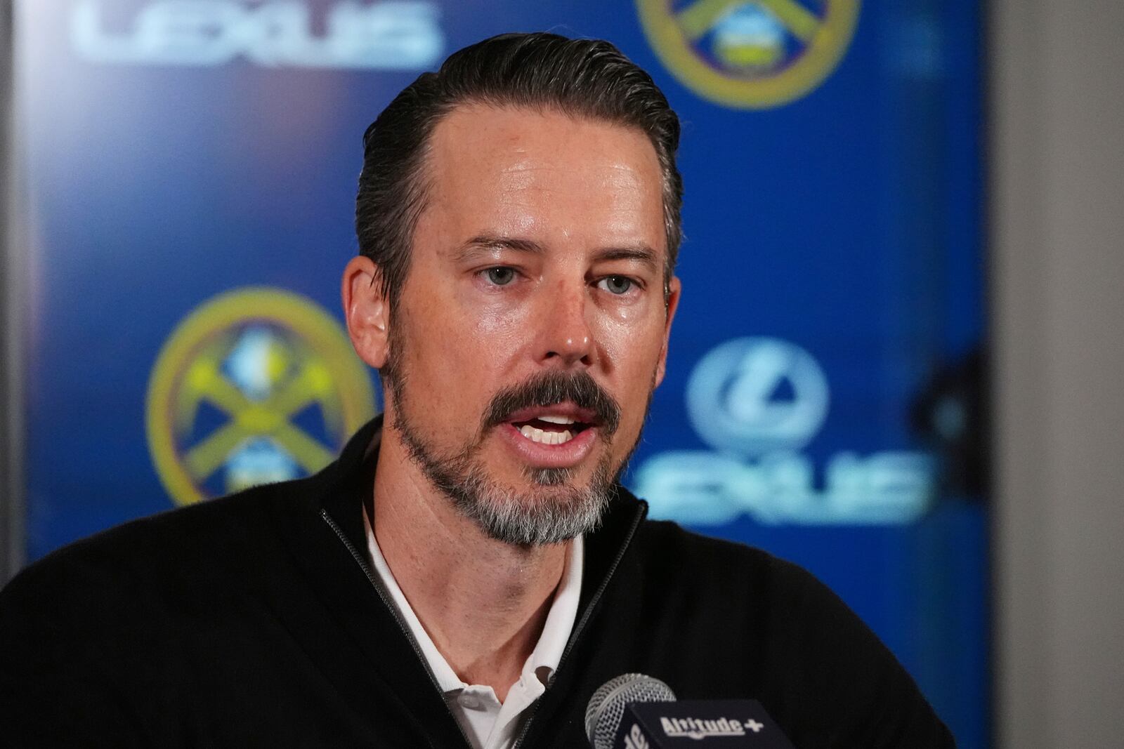 Denver Nuggets team president Josh Kroenke responds to questions at a news conference Monday, April 14, 2025, in Denver about the firing of the team's general manager and head coach last week. (AP Photo/David Zalubowski)