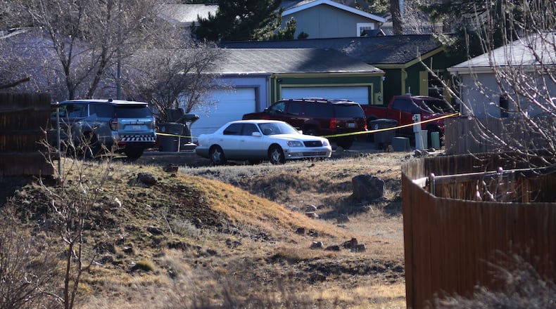 CORRECTS DATE: FILE - Law enforcement respond to a neighborhood in Flagstaff, Ariz., where police say a man opened fire on officers on Feb. 4, 2026. (AP Photo/Cheyanne Mumphrey, File)