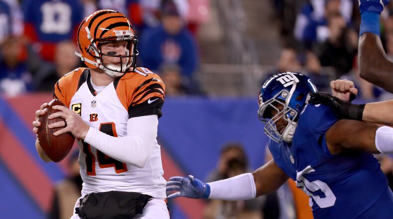 EAST RUTHERFORD, NJ - NOVEMBER 14: Andy Dalton #14 of the Cincinnati Bengals looks to throw a pass against the New York Giants during the first half of the game at MetLife Stadium on November 14, 2016 in East Rutherford, New Jersey. (Photo by Michael Reaves/Getty Images)