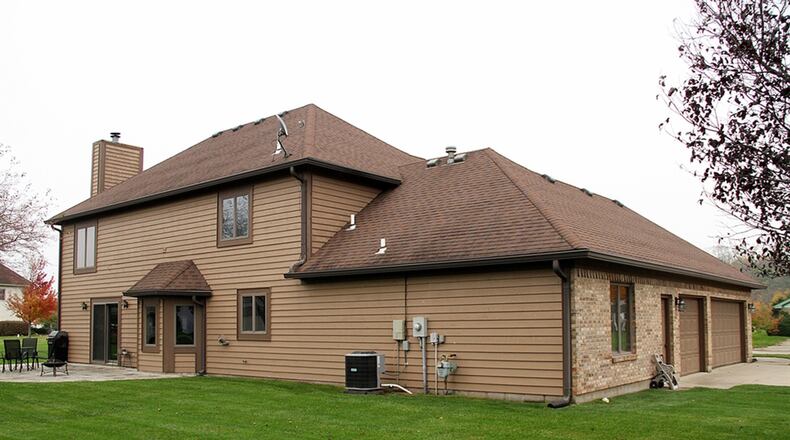Sliding patio doors open off the breakfast room out to a patio and open back yard.