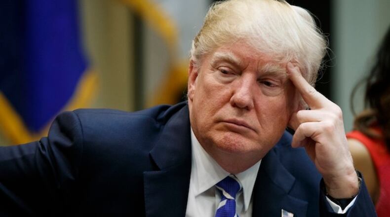 President Donald Trump listens during a meeting with women small business owners in the Roosevelt Room of the White House, Monday, March 27, 2017, in Washington. (AP Photo/Evan Vucci)