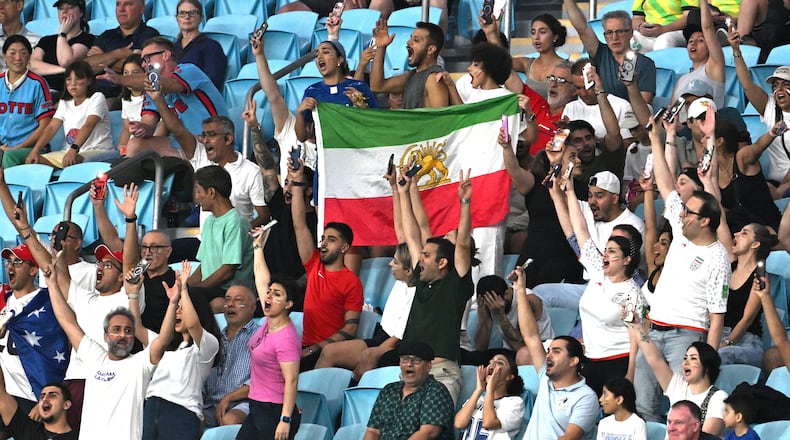Iranian supporters react during the Women's Asia Cup soccer match between Iran and South Korea on the Gold Coast, Australia, Monday, March 2, 2026. (Dave Hunt/AAPImage via AP)