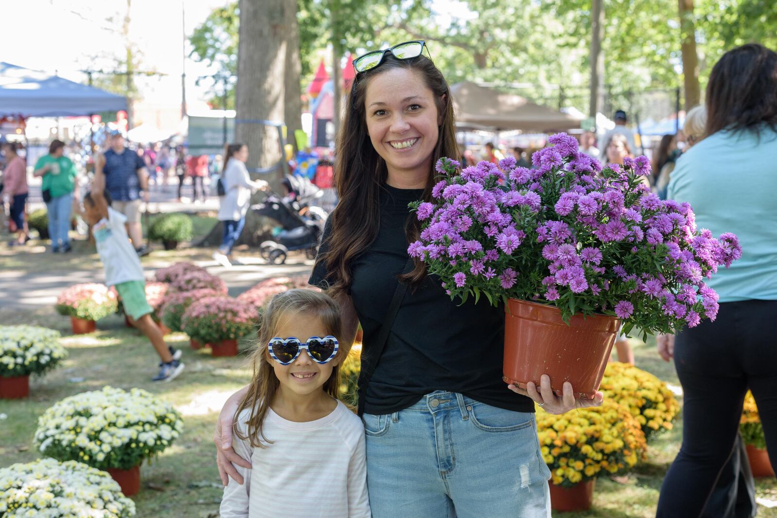 This year’s theme for the Tipp City Mum Festival is “Saved by the Mums, A tribute to the' 90s.” The festival will not only feature a variety of mum flowers, but an array of activities including a car show, 5K, parade and live entertainment. TOM GILLIAM / CONTRIBUTING PHOTOGRAPHER