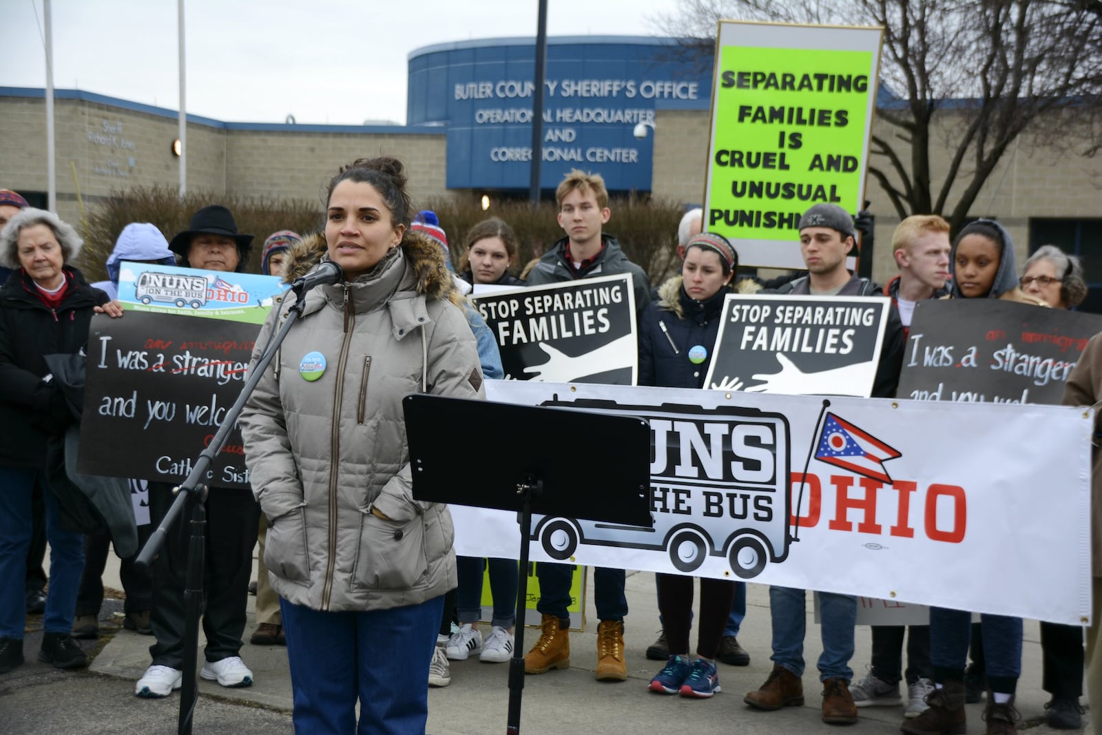 Sarah Madrigal, a mental health therapist who works in local schools with Catholic Charities, speaks in support of immigration reform during the Ohio Nuns on the Bus rally on Tuesday, March 20, in front of the Butler County Jail in Hamilton. MICHAEL D. PITMAN/STAFF