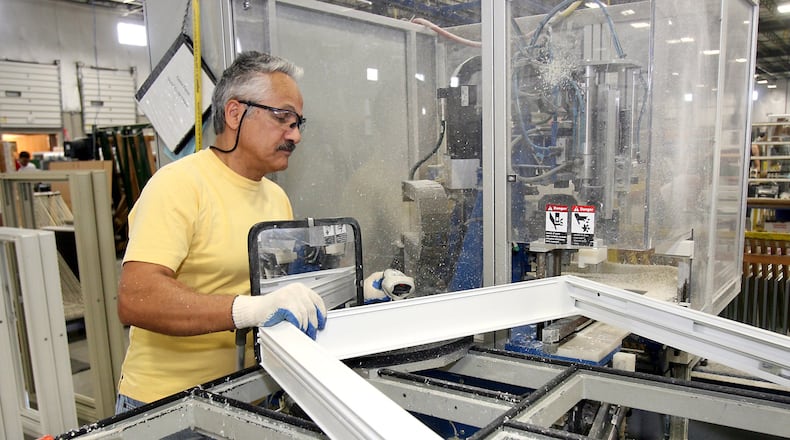 An employee assembles vinyl windows at Vinylmax in Hamilton. The company’s “aggressive growth strategy” finds it looking for 30 new employees over the next 18 months, according to Craig Doerger, owner and vice president of operations. STAFF FILE PHOTO