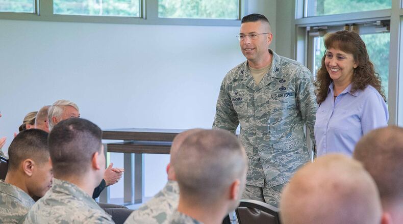 Col. Thomas Sherman, 88th Air Base Wing and installation commander, talks with Wing Staff Agency personnel at one of his first commander’s calls at Wright-Patterson Air Force Base, held at the Twin Base Golf Course June 26. He is accompanied by his wife, Laurie. Sherman took command one week earlier in a ceremony at the National Museum of the United States Air Force June 19. (U.S. Air Force photo/John Harrington)