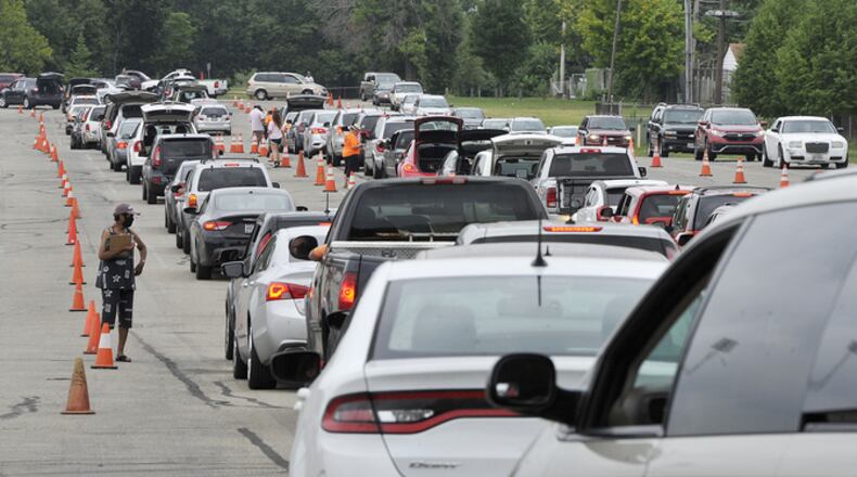 FILE PHOTO / The Foodbank held its mass food distribution Thursday, Aug. 27, 2020 at the University of Dayton Welcome Stadium.