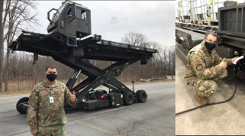 Master Sgt. Ryan Young, lead Halvorsen mechanic, 441st Vehicle Support Chain Operations Squadron, Johnstown, Pa., signals acceptance of the Hybrid Halvorsen prototype design, operational performance and charging interface. CONTRIBUTED PHOTO