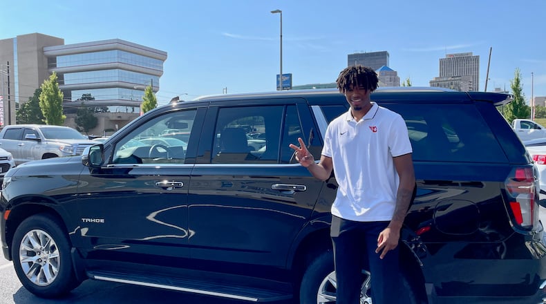 DaRon Holmes II poses for a photo on Friday, July 15, 2022, after receiving the keys to a Chevy Tahoe at White-Allen in Dayton. Photo courtesy of Matt Farrell