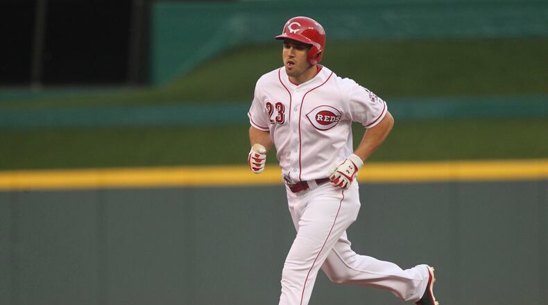 The Reds’ Adam Duvall rounds the bases after a three-run home run against the Cardinals on Tuesday, June 7, 2016, at Great American Ball Park in Cincinnati. David Jablonski/Staff