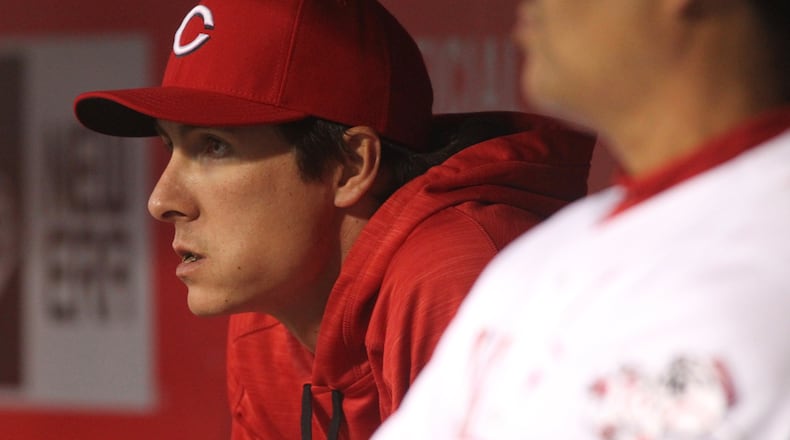 Reds pitcher Homer Bailey watches a game against the Cubs on Friday, April 22, 2016, at Great American Ball Park in Cincinnati. David Jablonski/Staff