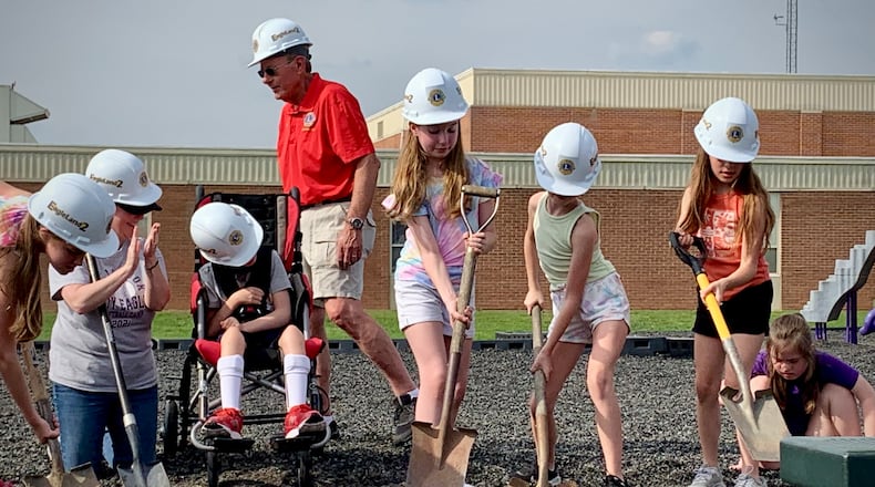 Bellbrook fourth graders break ground on an accessible playground that they inspired in their 3rd grade year. LONDON BISHOP/STAFF