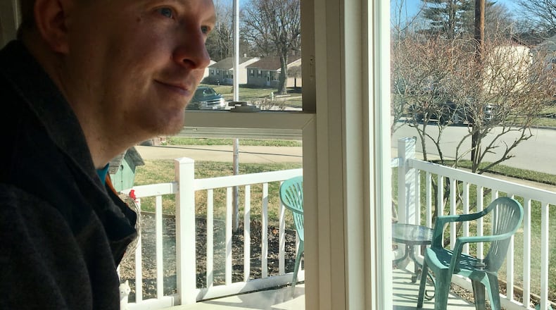 Rodger Zink, a veteran who served in the National Guard in Afghanistan and Iraq, looks out the window of his Fairborn home. Zink is one of thousands of vets who were overpaid by the Department of Veterans Affairs and had to pay the government back.