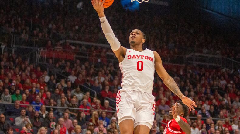 Dayton's Elijah Weaver scores an easy layup in Saturday's win over Northern Illinois at UD Arena. Jeff Gilbert/CONTRIBUTED