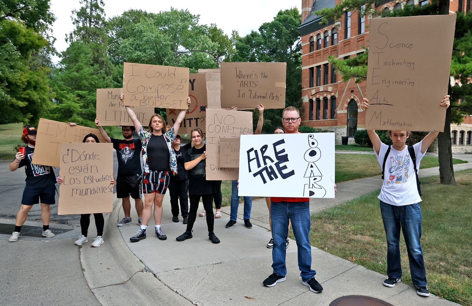A group of Wittenberg University students and faculty protest the recently announced budget cuts to programs and staff outside of Recitation Hall Friday, Sept. 6, 2024. BILL LACKEY/STAFF