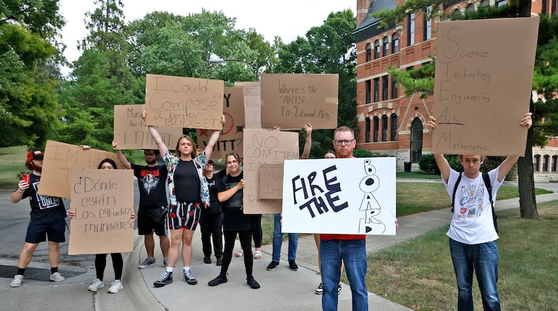 A group of Wittenberg University students and faculty protest the recently announced budget cuts to programs and staff outside of Recitation Hall Friday, Sept. 6, 2024. BILL LACKEY/STAFF