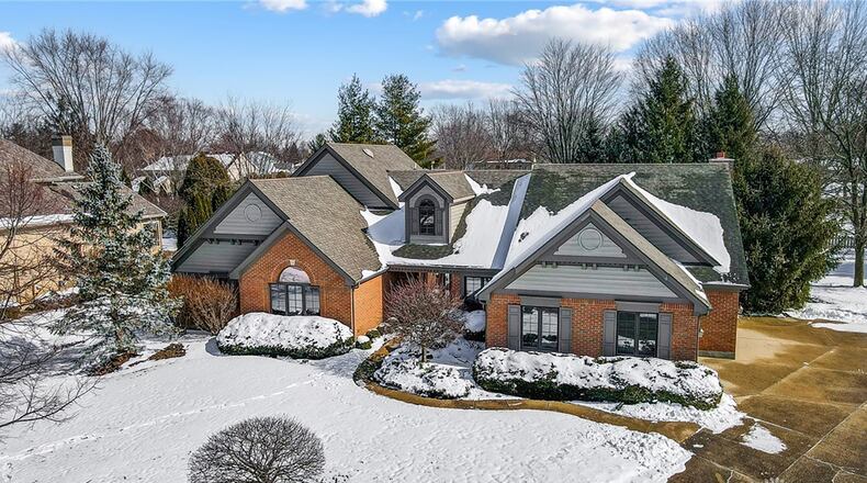 This custom two story home is on a cul-de-sac lot and has a three car side entry attached garage.