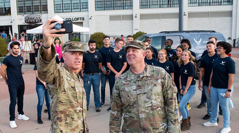 Chief Master Sgt. Jason Shaffer (left), 88th Air Base Wing command chief, and Col. Patrick Miller, 88 ABW and Wright-Patterson Air Force Base commander, take a selfie with Air Force Delayed Enlistment Program members Aug. 21 at Day Air Ballpark as part of the Dayton Dragons Hometown Heroes Night event. U.S. AIR FORCE PHOTO/WESLEY FARNSWORTH