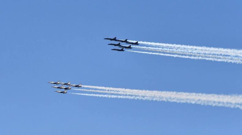 People watching a flyover at Houston National Cemetery were startled when a minivan driver rode over markers to avoid traffic.