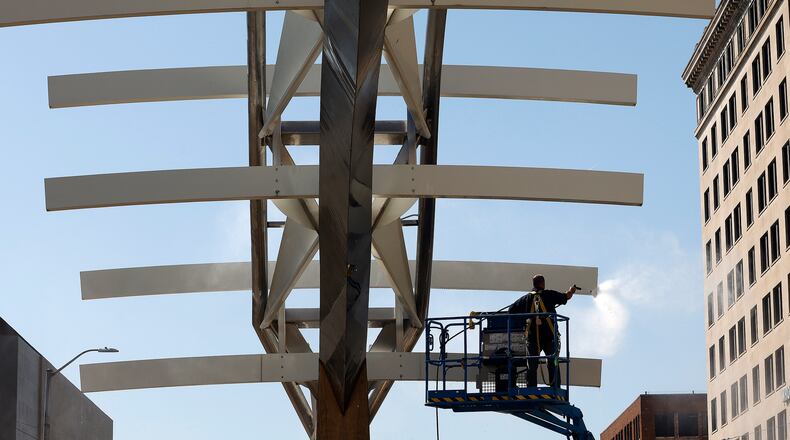 The Wright brothers "Flyover" sculpture/site on South Main Street in downtown Dayton is being restored. Phase 1 for 2024 includes general cleaning of the sculpture, replacing the current, non-operable lighting to LED fixtures, adding a landscape plan and repair/replace irrigation system for long-term care, and install new plaques that tell the history and feature the project partners/sponsors. MARSHALL GORBY\STAFF
