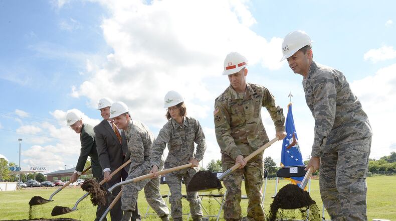(From the left) William Butt, Butt Construction Co. president; David Perkins, 88th Civil Engineer Group director; Col. Corey Munro, 88th Medical Group Pharmacy commander; Col. Shari Silverman, 88th Medical Group commander; Lt. Col. Robert Newbauer, U.S.Army Corps of Engineers, Louisville District deputy commander; and Col. Bradley McDonald, 88th Air Base Wing commander, ceremonially break groundJune 7 for the new Kittyhawk satellite pharmacy at Wright-Patterson Air Force Base. Construction completion is scheduled for the fall of 2018.(U.S.Air Force photo/Al Bright)