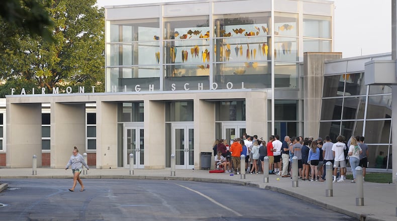 Fairmont High School students who intend to drive their personal vehicles to school assembled on Thursday morning to pay for their parking passes for the school parking lot. TY GREENLEES / STAFF