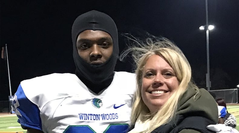 Jennifer Henson helps more than 300 students a year prepare for the ACT and increase their scores. She is shown with Chris Oats, a former football player at Winton Woods High School in Cincinnati. CONTRIBUTED