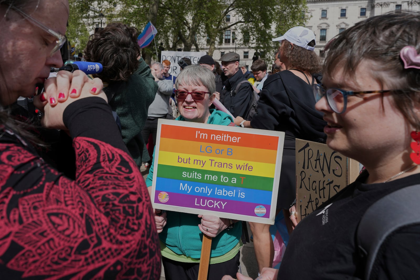 Campaigners take part in a rally organised by trans rights groups, trade unions, and community organisations following the Supreme Court ruling on the definition of a woman in equalities law, at Parliament Square, central London, Saturday April 19, 2025. (AP Photo/Alastair Grant)