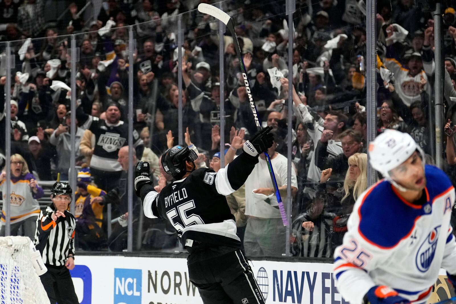 Los Angeles Kings right wing Quinton Byfield celebrates his goal as Edmonton Oilers defenseman Darnell Nurse skates away during the second period in Game 2 of an NHL hockey first-round playoff series Wednesday, April 23, 2025, in Los Angeles. (AP Photo/Mark J. Terrill)
