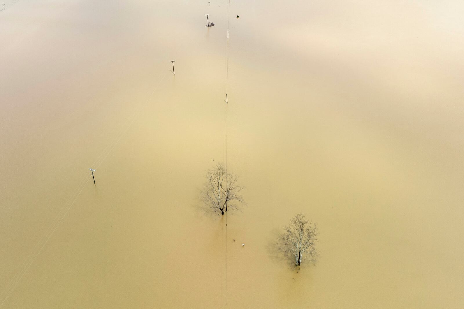 Floodwaters cover Kentucky Route 39 in Lincoln County, Ky., on Friday, April 4, 2025. (Ryan C. Hermens/Lexington Herald-Leader via AP)
