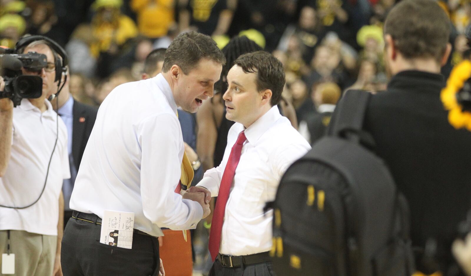 Will Wade and Archie Miller talk after a game at the Siegel Center on Jan. 27, 2017.