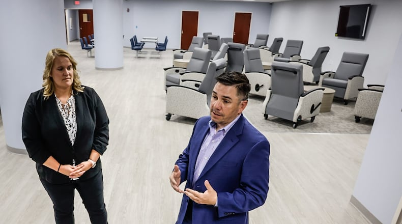 Janel Lieber, left, and Vincent Sabino gave the Dayton Daily News a tour of the Crisis Receiving Center on South Edwin C Moses Blvd. May 3, 2023. The center will help to reduce jail population and take the workload off of police who are dispatch to metal health emergencies. JIM NOELKER/STAFF