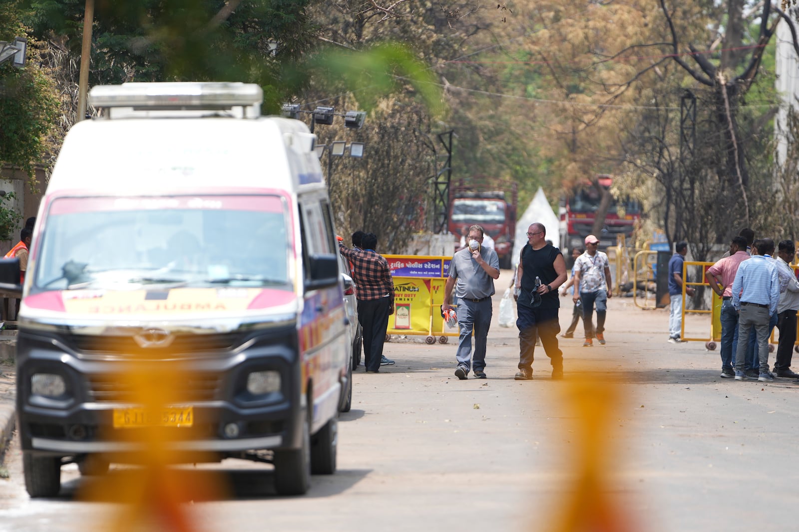 Investigators come out after visiting Thursday's Air India plane crash site in Ahmedabad, India, Sunday, June 15, 2025. (AP Photo/Ajit Solanki)