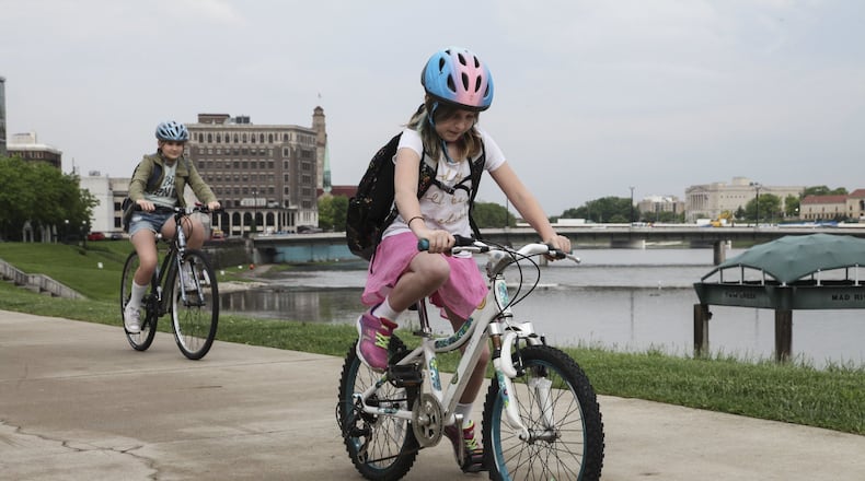 There are plenty of options for riding around the Miami Valley. And it’s important that children (and adults) wear a helmet. CONTRIBUTED/JESSICA HANSBAUER