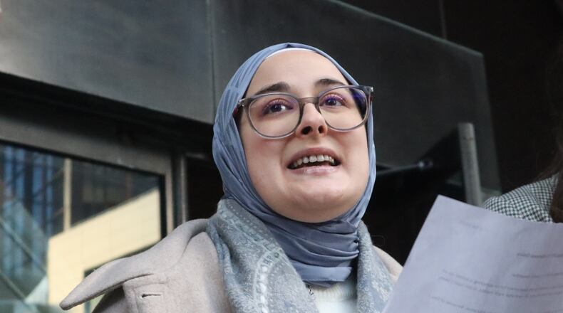 Tufts University doctoral student Rumeysa Ozturk reads from a prepared statement following a court hearing outside the John Joseph Moakley United States Courthouse Thursday, Dec. 4, 2025, in Boston. (AP Photo/Leah Willingham)
